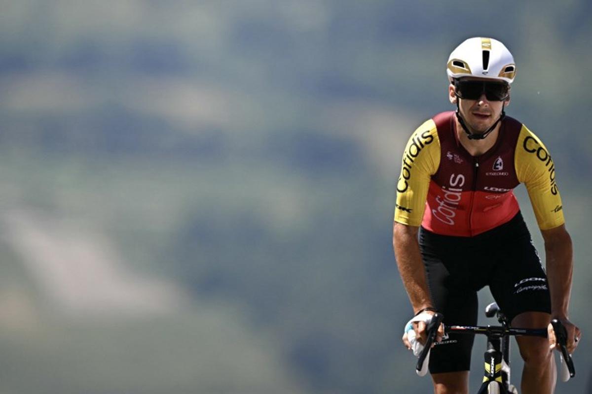 Cofidis team's French rider Bryan Coquard cycles to the finish line of the 13th stage of the 112th edition of the Tour de France cycling race, 10.9 km individual time trial between Loudenvielle and Peyragudes, in the Pyrenees mountains of southwestern France, on July 18, 2025.  Loic VENANCE / AFP