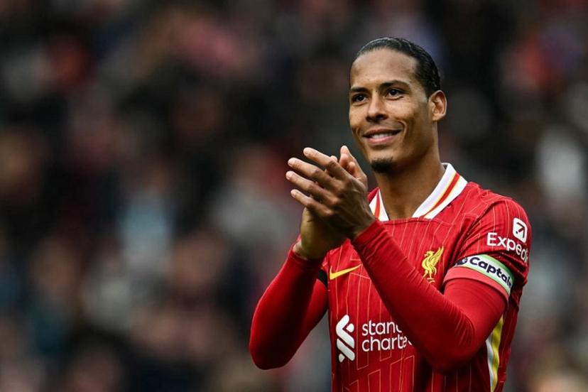 Liverpool's Dutch defender #04 Virgil van Dijk applauds at the end of the English Premier League football match between Liverpool and West Ham United at Anfield in Liverpool, north west England on April 13, 2025. Liverpool wins 2 - 1 against West Ham United. Paul ELLIS / AFP
