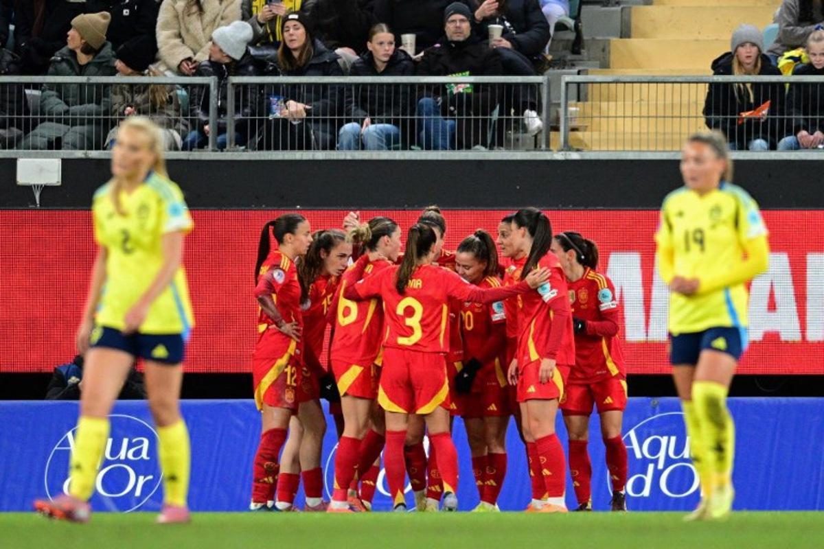 Spain's midfielder #11 Alexia Putellas celebrates scoring the opening goal with her teammates during the UEFA Women's Nations League 2nd-leg semi-final football match between Sweden and Spain at Gamla Ullevi Stadium in Gothenburg, Sweden on October 28, 2025.   Bjorn LARSSON ROSVALL / TT NEWS AGENCY / AFP