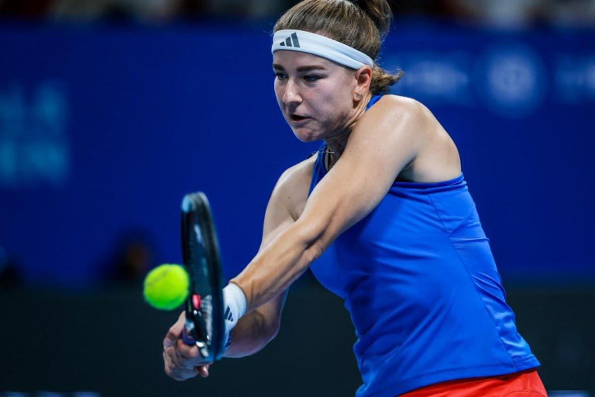 Czech Republic's Karolina Muchova hits a return to Spain's Jessica Bouzas Maneiro during their women's singles semi-final match at the Billie Jean King Cup tennis tournament in Shenzhen, in China's southern Guangdong province on September 25, 2026.   CN-STR / AFP