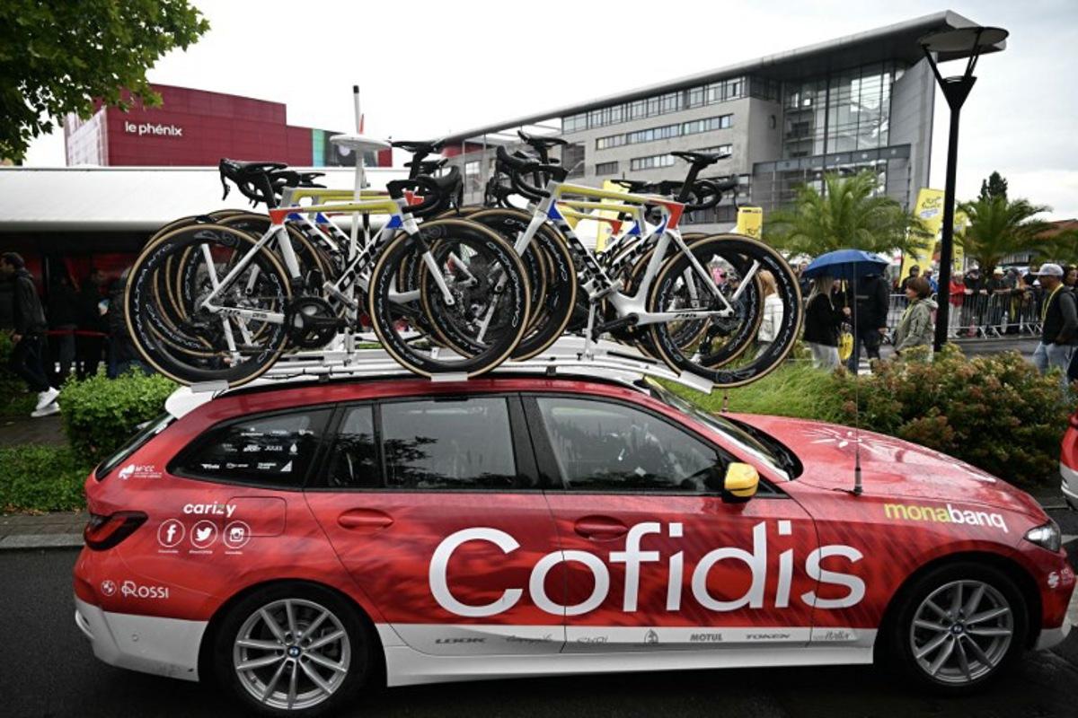 Bicycles sit on a roof-rack atop a Cofidis team vehicle before the start of the 3rd stage of the 112th edition of the Tour de France cycling race, 178.3 km between Valenciennes and Dunkerque (Dunkirk), Northern France, on July 7, 2025. The Cofidis team had 11 bicycles stolen from a team truck on the night of July 5 to July 6, before the Tour de France's 2nd stage, in northern France. Loic VENANCE / AFP