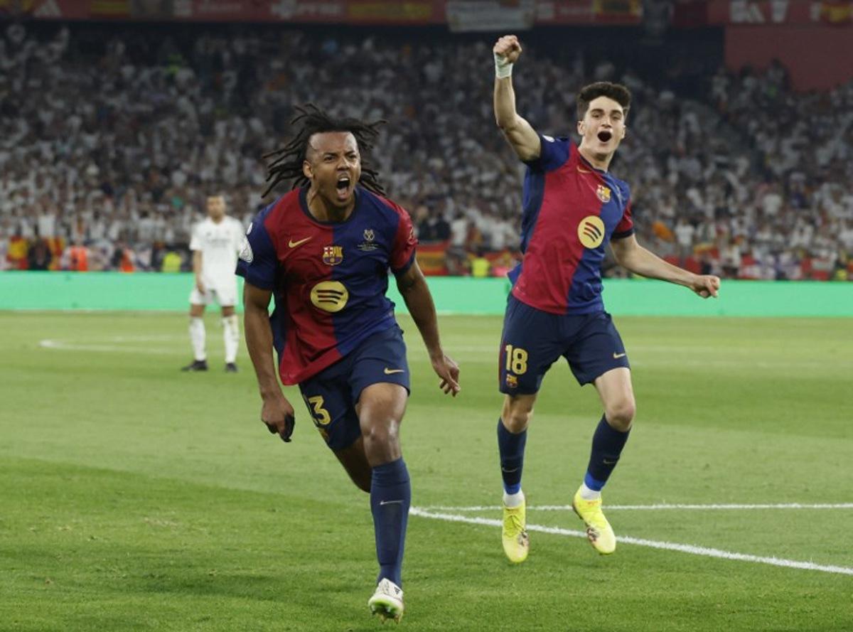Barcelona's French defender #23 Jules Kounde (L) celebrates scoring his team's third goal during their Spanish Cup, Copa del Rey (King's Cup) final football match between FC Barcelona and Real Madrid CF at La Cartuja stadium in Seville on April 26, 2025.  Pierre-Philippe MARCOU / AFP