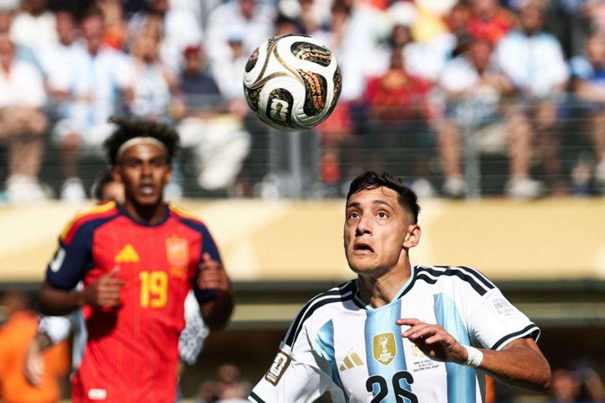 Argentina's defender #26 Nahuel Molina looks at the ball during the 2026 World Cup football tournament final match between Spain and Argentina at the New York/New Jersey Stadium in East Rutherford on July 19, 2026.   FRANCK FIFE / AFP