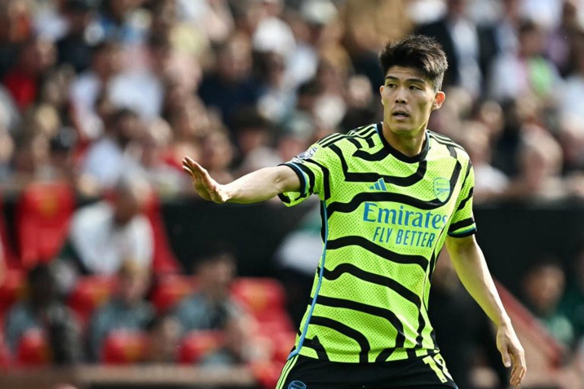 Arsenal's Japanese defender #18 Takehiro Tomiyasu reacts during the English Premier League football match between Manchester United and Arsenal at Old Trafford in Manchester, north west England, on May 12, 2024.  Paul ELLIS / AFP