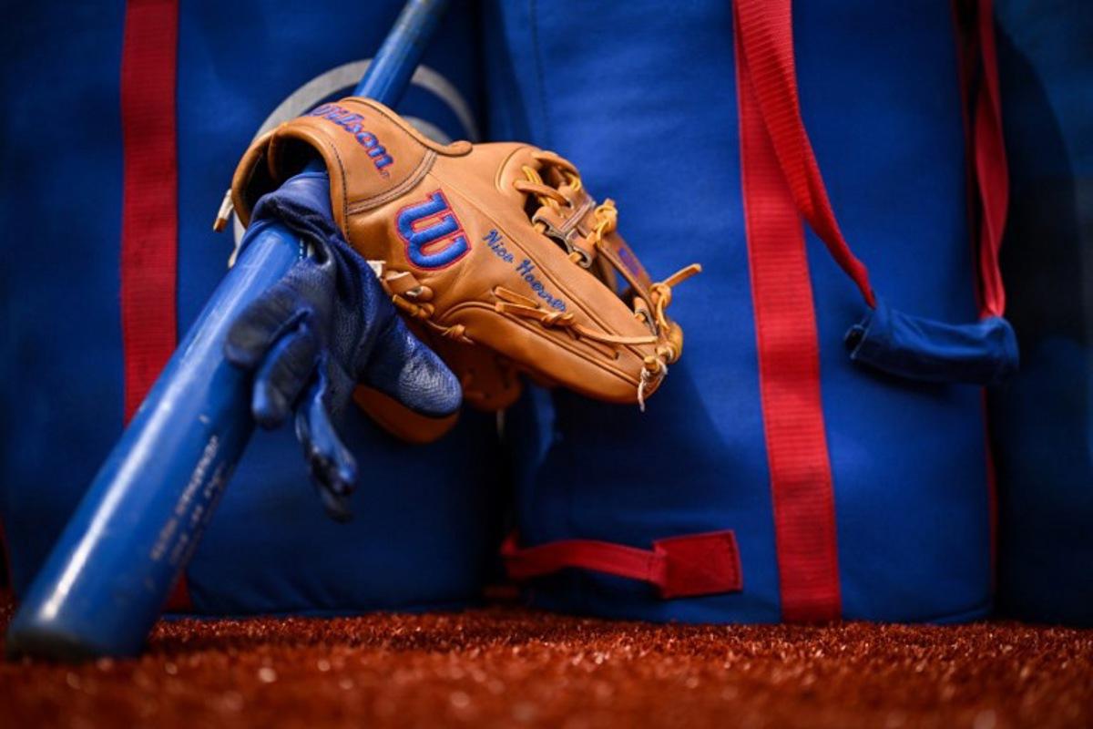 The glove and bat of Chicago Cubs' Nico Hoerner  are pictured prior to the first of the two-game, 2023 major league baseball London Series between the St. Louis Cardinals and the Chicago Cubs at London Stadium in east London on June 24, 2023.  Ben Stansall / AFP