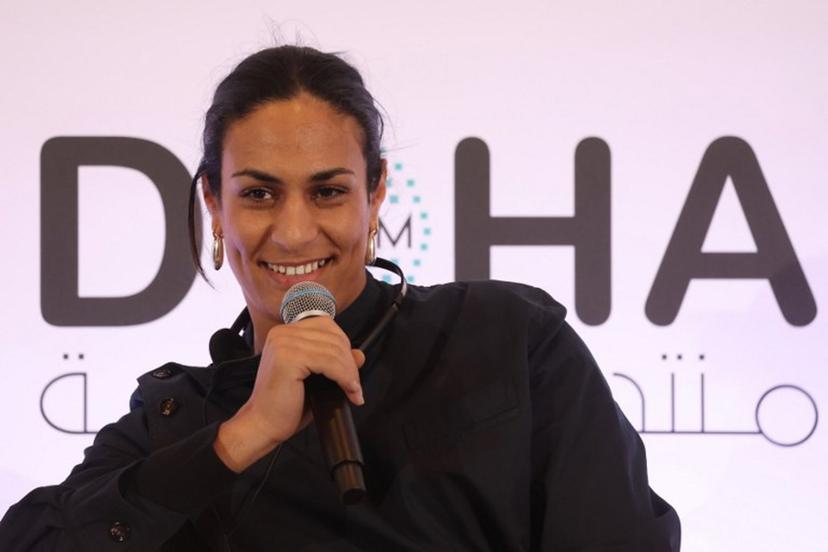 Algerian gold medallist boxer Imane Khelif speaks during the Doha Forum in the Qatari capital on December 7, 2024.  KARIM JAAFAR / AFP