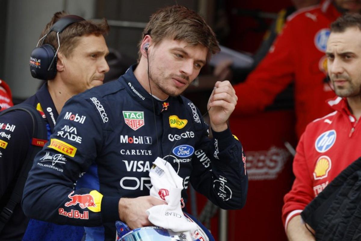 Red Bull Racing's Dutch driver Max Verstappen takes off his earpiece in the pits during the qualifying session ahead of the Formula One Japanese Grand Prix at the Suzuka circuit in Suzuka, Mie prefecture on March 28, 2026.  FRANCK ROBICHON / POOL / AFP