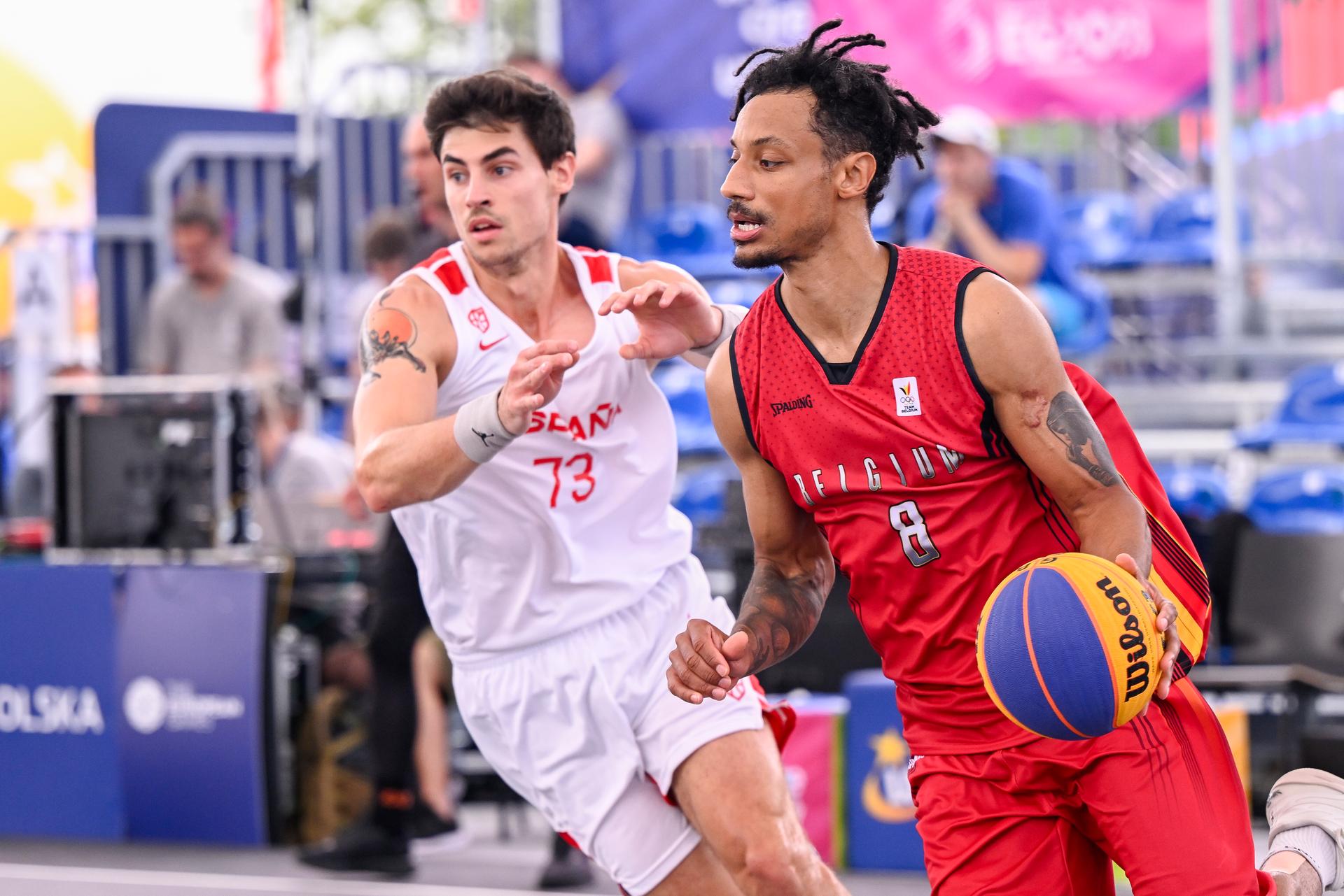Spanish Jon Galarza and Belgian Dennis Donkor pictured in action during the match between Belgium and Spain, in Pool D of the men's preliminary round of the Basket 3x3 competition, on the third day of the European Games, in Krakow, Poland, Friday 23 June 2023. The 3rd European Games, informally known as Krakow-Malopolska 2023, is a scheduled international sporting event that will be held from 21 June to 02 July 2023 in Krakow and Malopolska, Poland. BELGA PHOTO LAURIE DIEFFEMBACQ