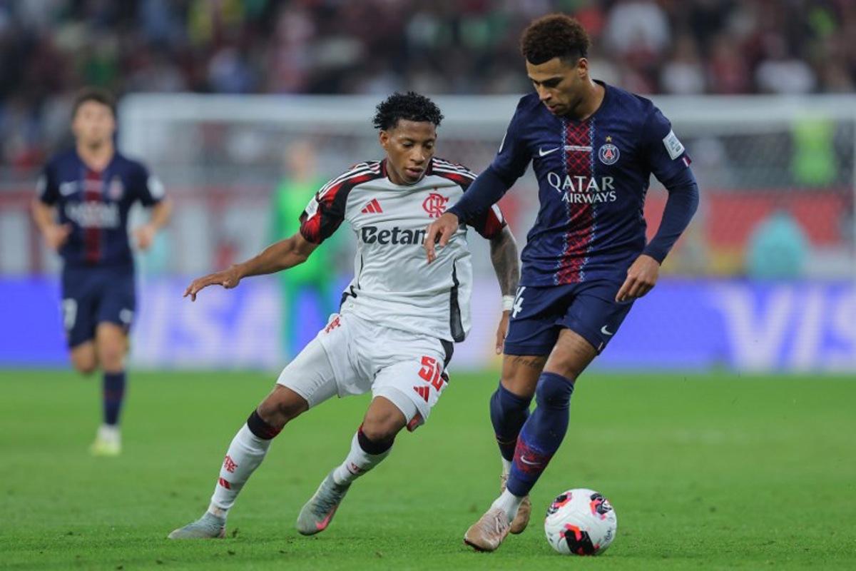 CR Flamengo's Ecuadorian forward #50 Gonzalo Plata (L) and Paris Saint-Germain's French midfielder #14 Desire Doue fight for the ball during the 2025 FIFA Intercontinental Cup final football match between Paris Saint-Germain (PSG) and CR Flamengo at the Ahmad bin Ali Stadium in Al-Rayyan on the outskirts of Doha on December 17, 2025.  Karim JAAFAR / AFP