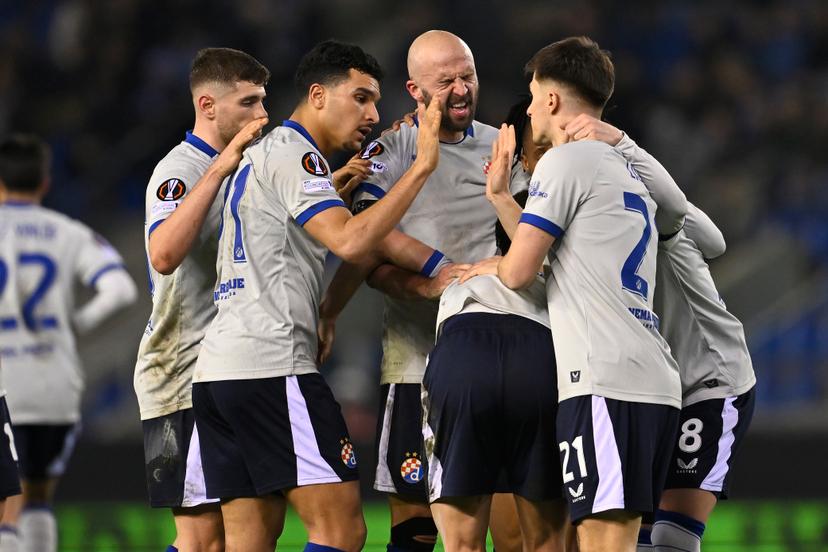 Dinamo's players celebrate after scoring during a soccer game between Belgian team KRC Genk and Croatian GNK Dinamo Zagreb, Thursday 26 February 2026 in Genk, in the play-off for the knockout phase of the UEFA Europa League tournament. Genk won the first leg 1-3. BELGA PHOTO JOHAN EYCKENS
