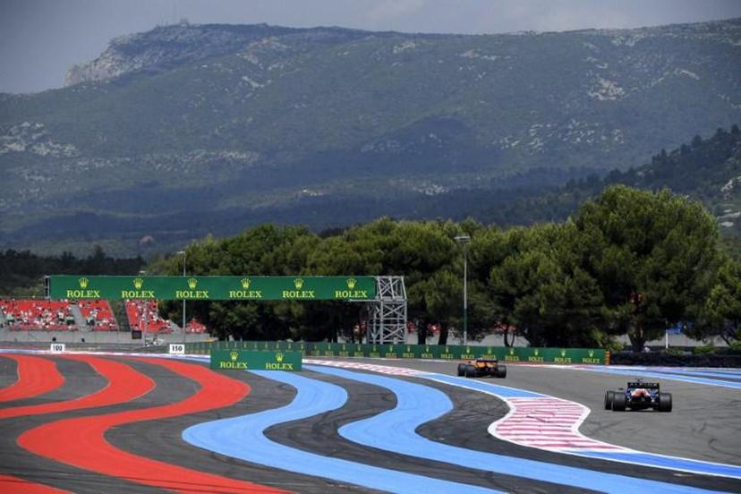 McLaren's British driver Lando Norris drives ahead of Alpine's French driver Esteban Ocon (R) during the first practice session at the Circuit Paul-Ricard in Le Castellet, southern France, on June 18, 2021, two days ahead of the French Formula One Grand Prix.  NICOLAS TUCAT / AFP