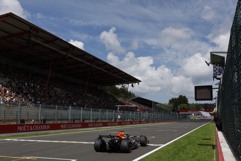 Red Bull Racing's Dutch driver Max Verstappen crosses the finish line in first position during the Sprint Race of the Formula One Belgian Grand Prix at the Spa-Francorchamps circuit in Spa, on July 26, 2025.  STEPHANIE LECOCQ / POOL / AFP