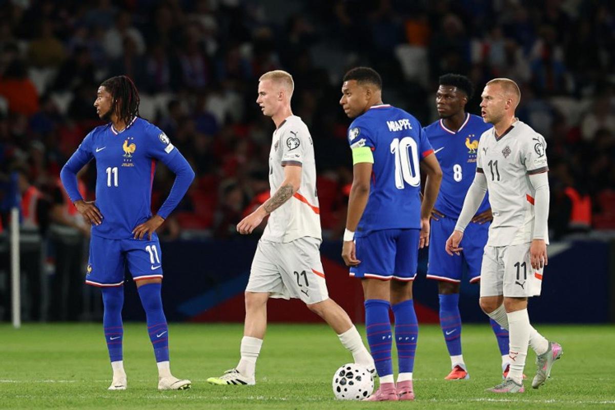 Iceland's forward #21 Daniel Gudjohnsen (2nd L) and Iceland's midfielder #11 Jon Dagur Thorsteinsson (R) reacts next to France's forward #11 Michael Olise (L), France's forward #10 Kylian Mbappe (C) and France's midfielder #08 Aurelien Tchouameni (2nd R) after Iceland scored the opening goal  during the FIFA World Cup 2026 Group D European qualification football match between France and Iceland at the Parc des Princes stadium in Paris, on September 9, 2025.  FRANCK FIFE / AFP