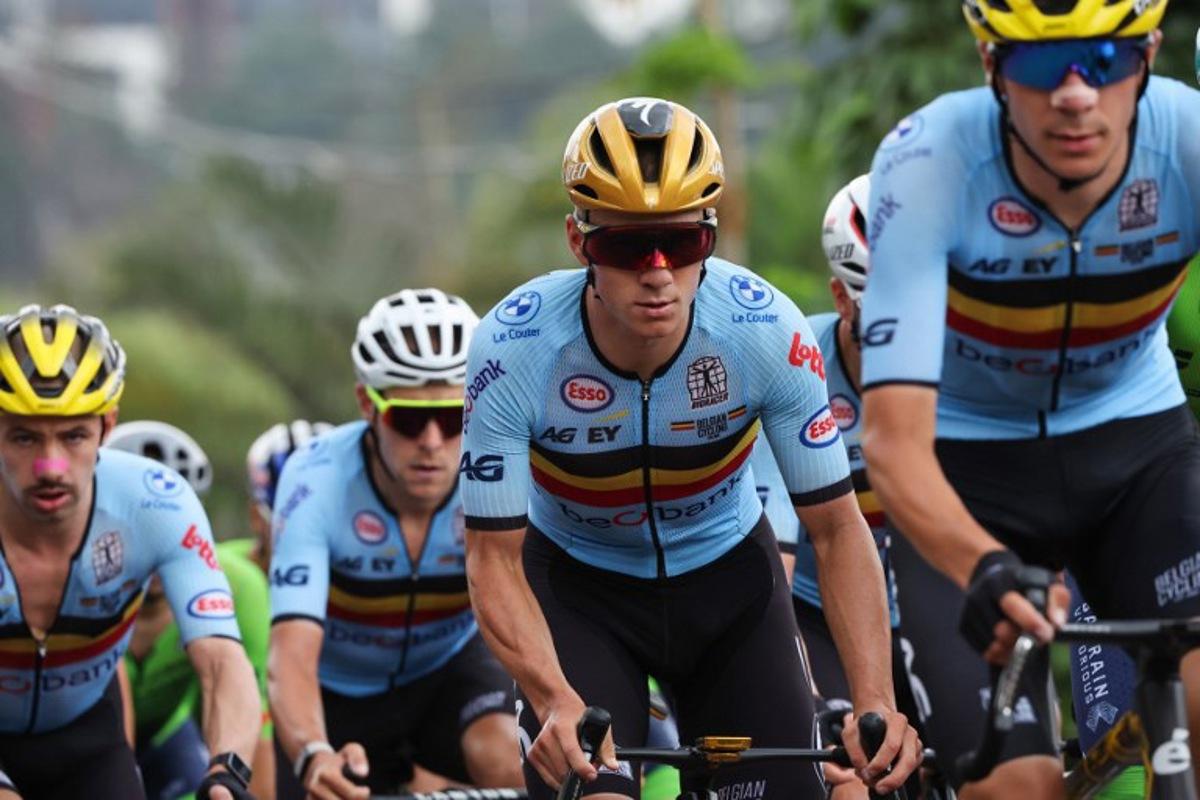Belgian rider Remco Evenepoel (2nd R) competes in the men's Elite road race cycling event during the UCI 2025 Road World Championships, in Kigali, on September 28, 2025.  Anne-Christine POUJOULAT / AFP