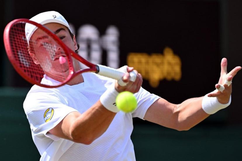 Brazil's Joao Fonseca returns to Russia's Roman Safiullin during their men's singles third round tennis match on the fifth day of the 2026 Wimbledon Championships at The All England Lawn Tennis and Croquet Club in Wimbledon, southwest London, on July 3, 2026.  Kirill KUDRYAVTSEV / AFP