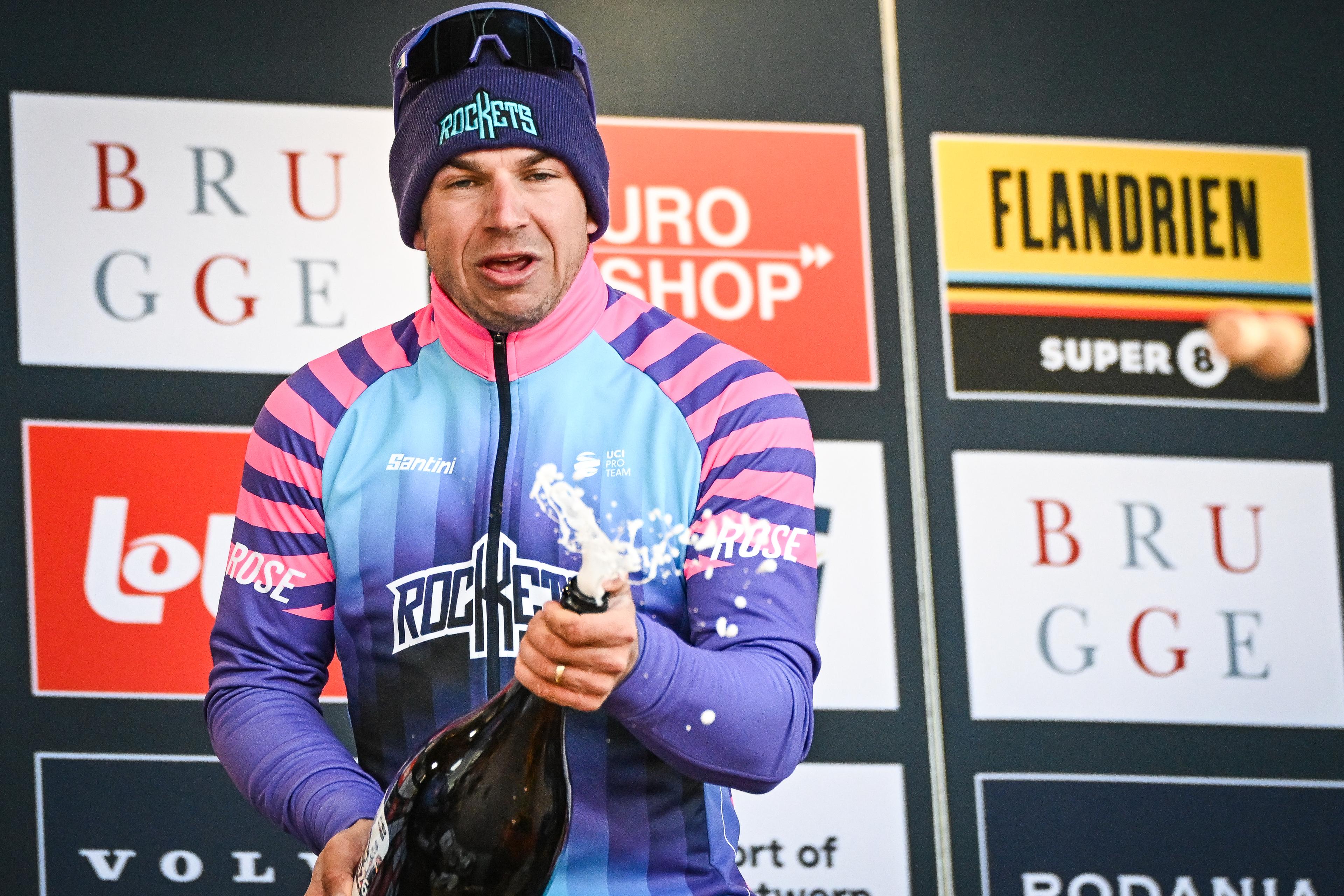Dutch Dylan Groenewegen of Unibet Rose Rockets celebrates on the podium with champagne after winning the 'Ronde van Brugge' men's elite one-day cycling race, 202,9 km from and to Brugge on Wednesday 25 March 2026. BELGA PHOTO ELIAS ROM