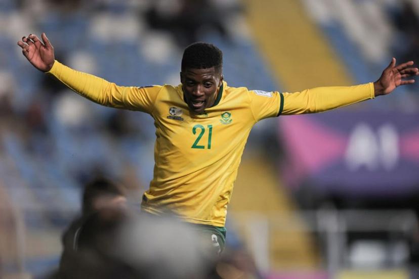 South Africa's forward #21 Siviwe Magidigidi celebrates scoring his team's fourth goal during the 2025 FIFA U-20 World Cup football match between South Africa and New Caledonia at El Teniente Stadium in Rancagua, Chile on October 2, 2025.  Javier TORRES / AFP
