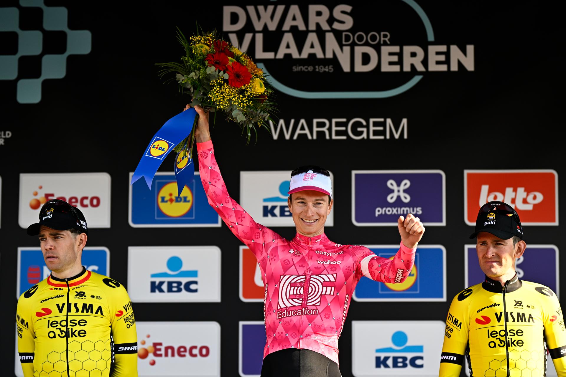 Belgian Wout van Aert of Team Visma-Lease a Bike, American Neilson Powless of EF Education-EasyPost and Belgian Tiesj Benoot of Team Visma-Lease a Bike celebrate on the podium of the men elite race of the 'Dwars Door Vlaanderen' cycling event, 184,2km from Roeselare to Waregem, Wednesday 02 April 2025. BELGA PHOTO JASPER JACOBS