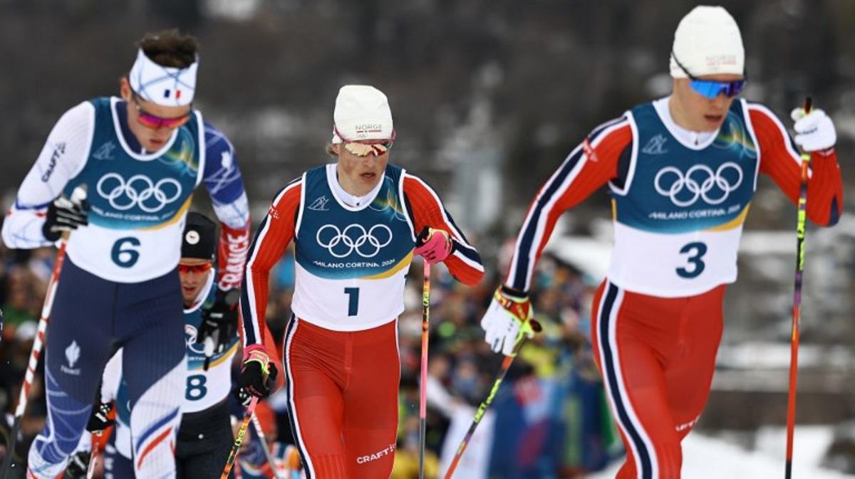 (From L) France's Mathis Desloges, Norway's Johannes Hoesflot Klaebo and Norway's Martin Loewstroem Nyenget compete during the men's cross country 50km mass start final event of the Milano Cortina 2026 Winter Olympic Games at Tesero Cross-Country Skiing Stadium in Lago di Tesero (Val di Fiemme) on February 21, 2026.  Anne-Christine POUJOULAT / AFP