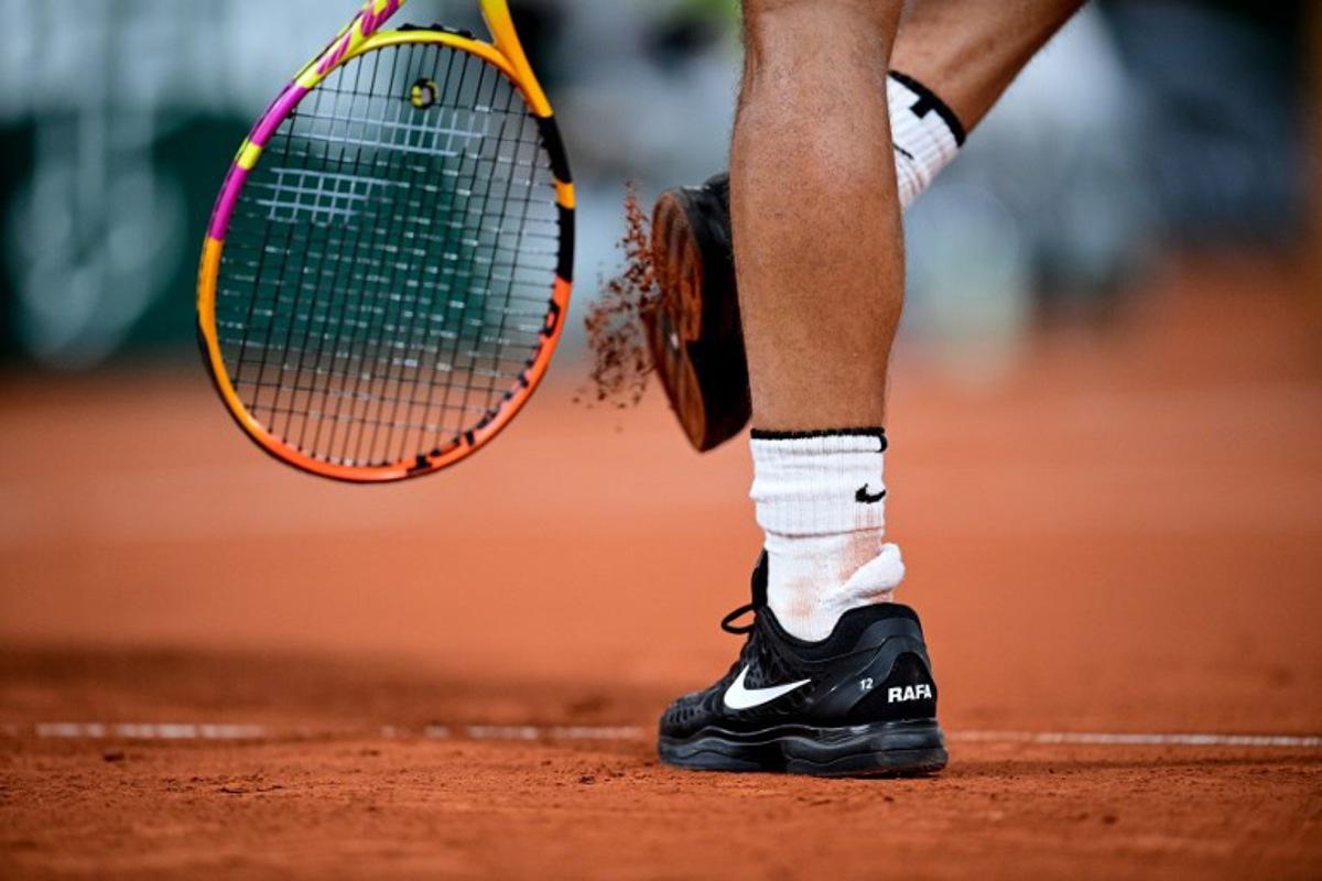 View of the shoes of Spain's Rafael Nadal as he plays against Italy's Jannik Sinner during their men's singles quarter-final tennis match on Day 10 of The Roland Garros 2020 French Open tennis tournament in Paris on October 6, 2020.  MARTIN BUREAU / AFP