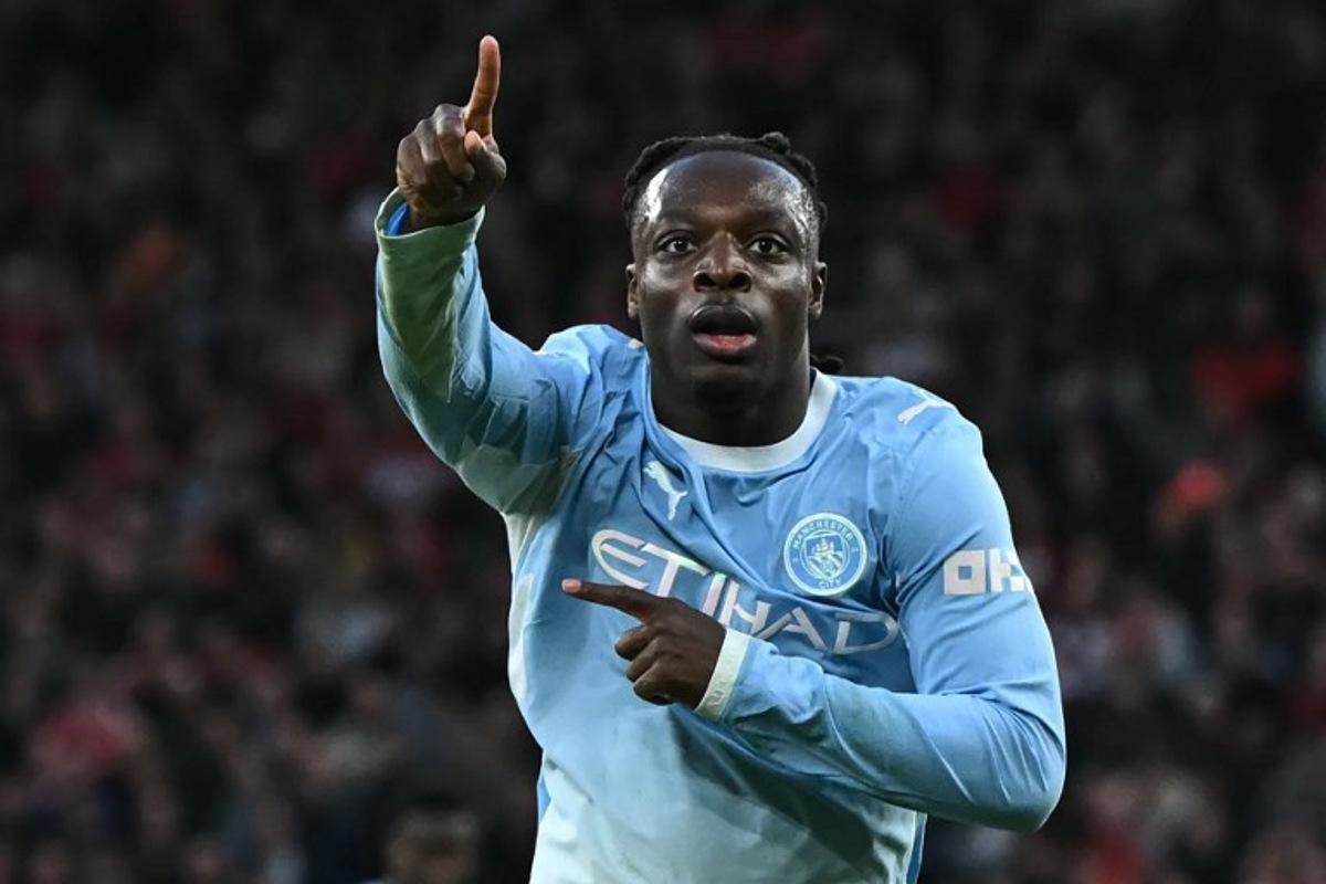 Manchester City's Belgian midfielder #11 Jeremy Doku celebrates after scoring their second goal during the English Premier League football match between Liverpool and Manchester City at Anfield in Liverpool, north west England on October 11, 2026.  Paul ELLIS / AFP