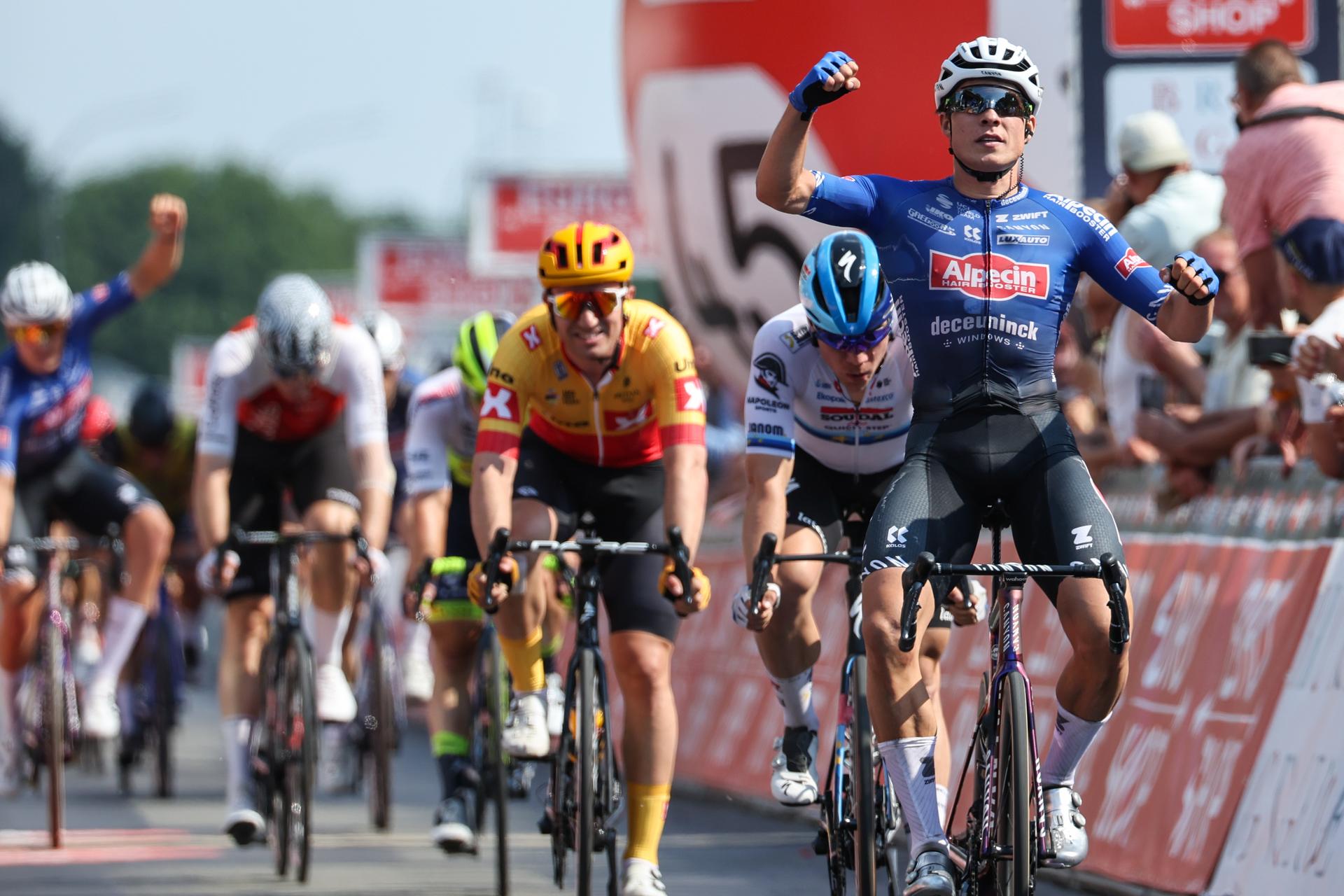Belgian Jasper Philipsen of Alpecin-Deceuninck celebrates as he crosses the finish line to win the Elfstedenronde one day cycling race, race 8 (out of 10) of the Lotto Cycling Cup, 190,3km with start and finish in Brugge, Sunday 11 June 2023. BELGA PHOTO DAVID PINTENS