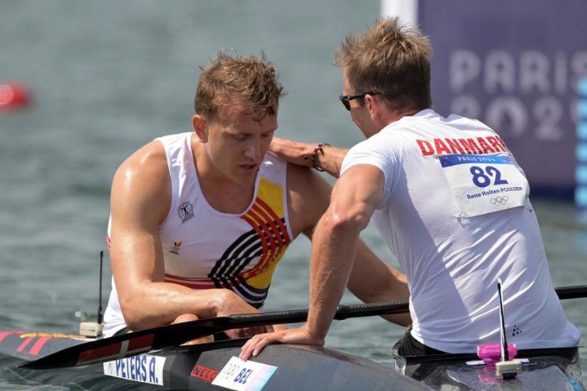 Denmark's Rene Holten Poulsen conforts Belgium's Artuur Peters (L) after the men's kayak single 1000m quarterfinals canoe sprint competition at Vaires-sur-Marne Nautical Stadium in Vaires-sur-Marne during the Paris 2024 Olympic Games on August 7, 2024.  Bertrand GUAY / AFP