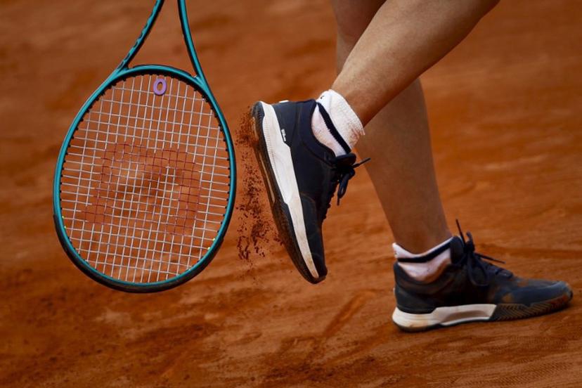 France's Leolia Jeanjean taps her shoe with her racket during her women's singles match against Romania's Elena Ruxandra Bertea at the Billie Jean King Cup play-offs between France and Romania, at Oeiras on the outskirts of Lisbon, on April 9, 2026.  FILIPE AMORIM / AFP