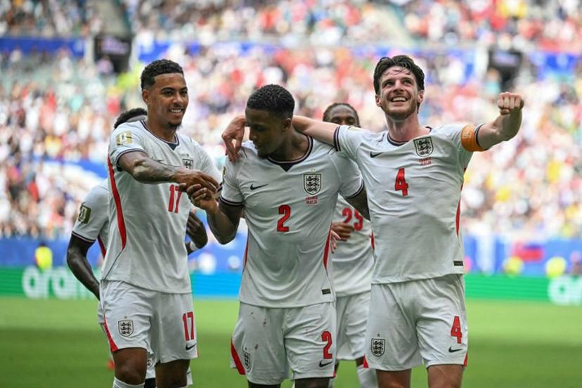 England's defender #02 Ezri Konsa celebrates scoring his team's second goal with  England's midfielder #17 Morgan Rogers and England's midfielder #04 Declan Rice during the 2026 World Cup football tournament third-place match between France and England at the Miami Stadium in Miami on July 18, 2026.   CHANDAN KHANNA / AFP