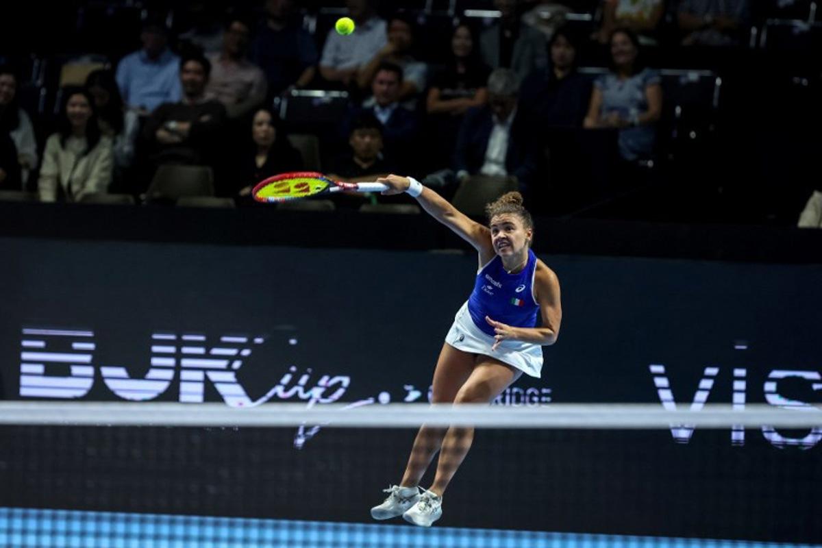 Italy's Jasmine Paolini hits a return to Ukraine's Elina Svitolina during their second singles semi-final match at the Billie Jean King Cup in Shenzhen, southern China's Guangdong province on September 19, 2025.   STR / AFP