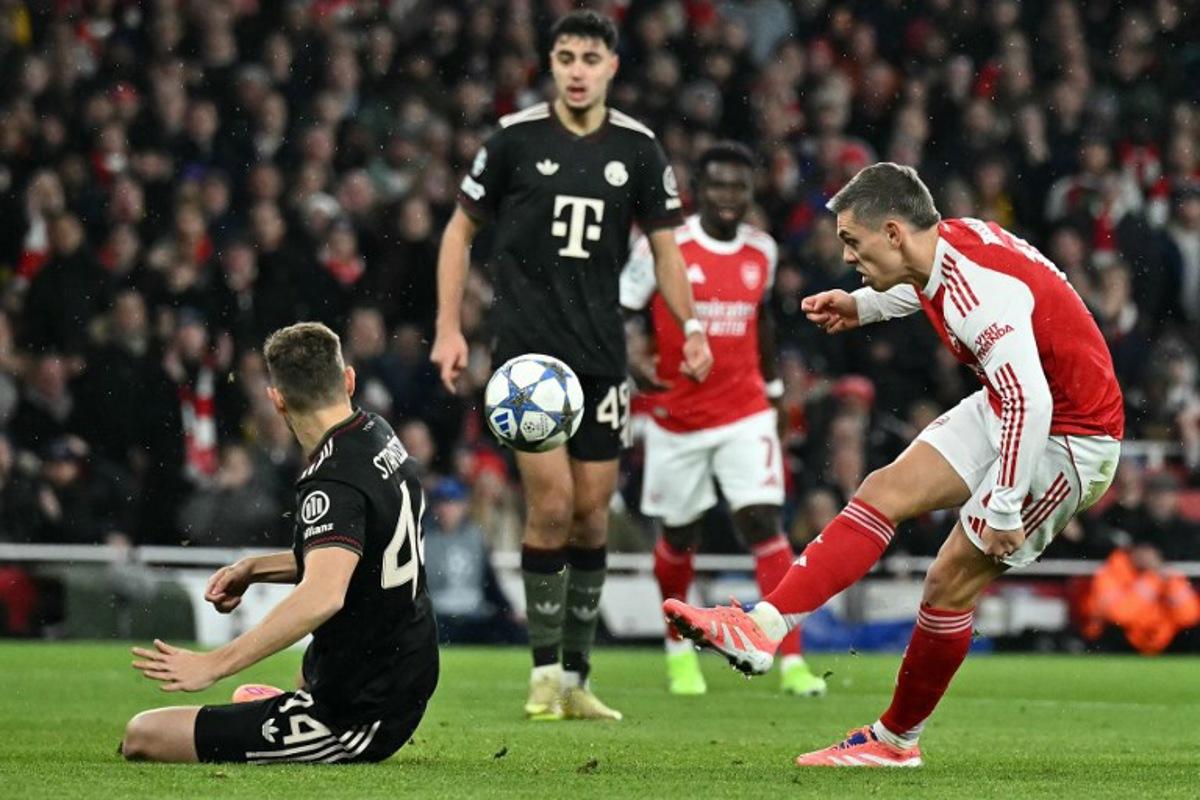 Arsenal's Belgian midfielder #19 Leandro Trossard shoots but fails to score during the UEFA Champions League league phase football match between Arsenal and Bayern Munich at the Emirates Stadium in north London on November 26, 2025.  Ben STANSALL / AFP