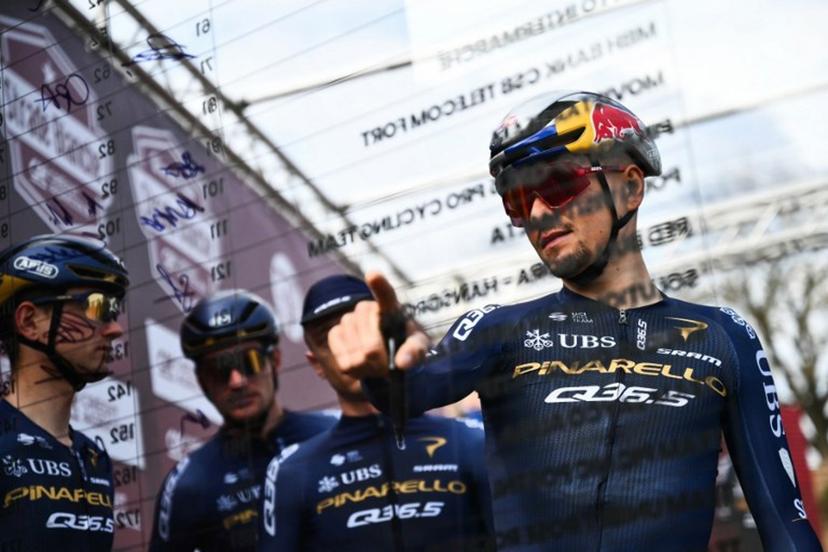 Pinarello-Q36.5 Pro Cycling Team's British Thomas Pidcock signs ahead of the 20th one-day classic 'Strade Bianche' (White Roads) men's cycling race between Siena and Siena in Tuscany on March 7, 2026.  Marco BERTORELLO / AFP