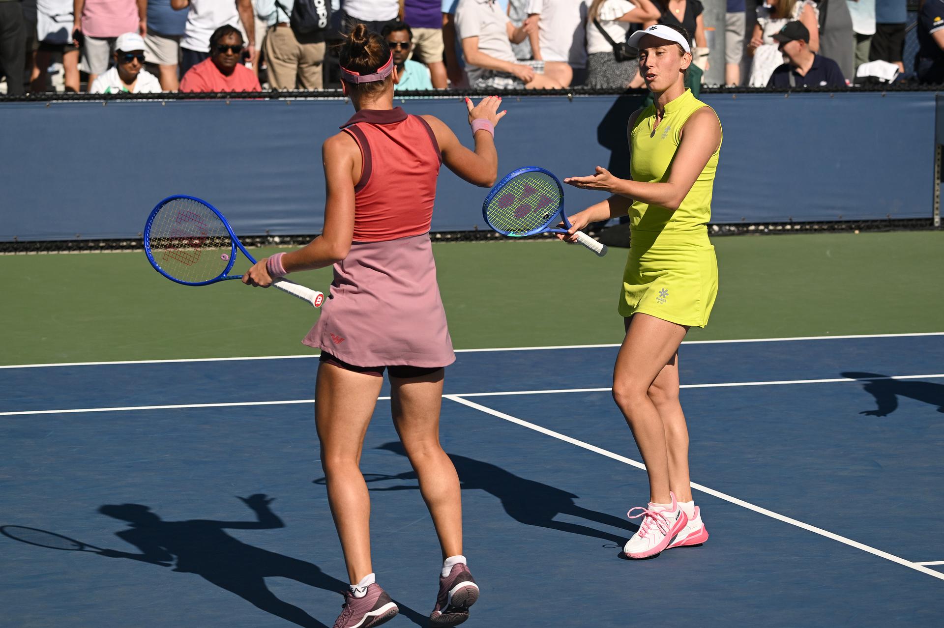 Belgian Elise Mertens (yellow) and Veronika Kudermetova (pink) pictured during a tennis match against US pair Brantmeier-Hamilton, in the second round of the women's doubles of the 2025 US Open Grand Slam tennis tournament in New York City, USA, Saturday 30 August 2025. BELGA PHOTO TONY BEHAR