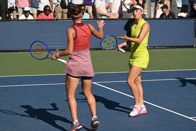 Belgian Elise Mertens (yellow) and Veronika Kudermetova (pink) pictured during a tennis match against US pair Brantmeier-Hamilton, in the second round of the women's doubles of the 2025 US Open Grand Slam tennis tournament in New York City, USA, Saturday 30 August 2025. BELGA PHOTO TONY BEHAR