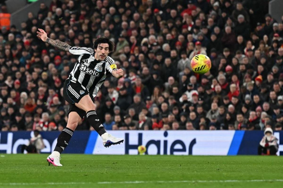 Newcastle United's Italian midfielder #08 Sandro Tonali shoots but fails to score during the English Premier League football match between Liverpool and Newcastle United at Anfield in Liverpool, north west England on January 31, 2026.  Paul ELLIS / AFP