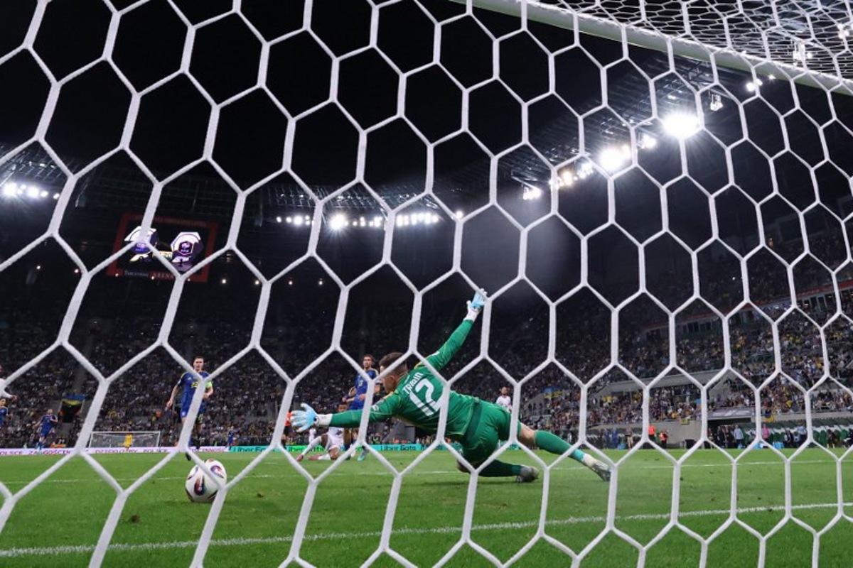 Ukraine's goalkeeper #12 Anatoliy Trubin concedes second goal 0:2 during the 2026 World Cup qualifiers Europe zone group D football match between Ukraine and France, on September 5, 2025 in Wroclaw, Poland.  Franck FIFE / AFP