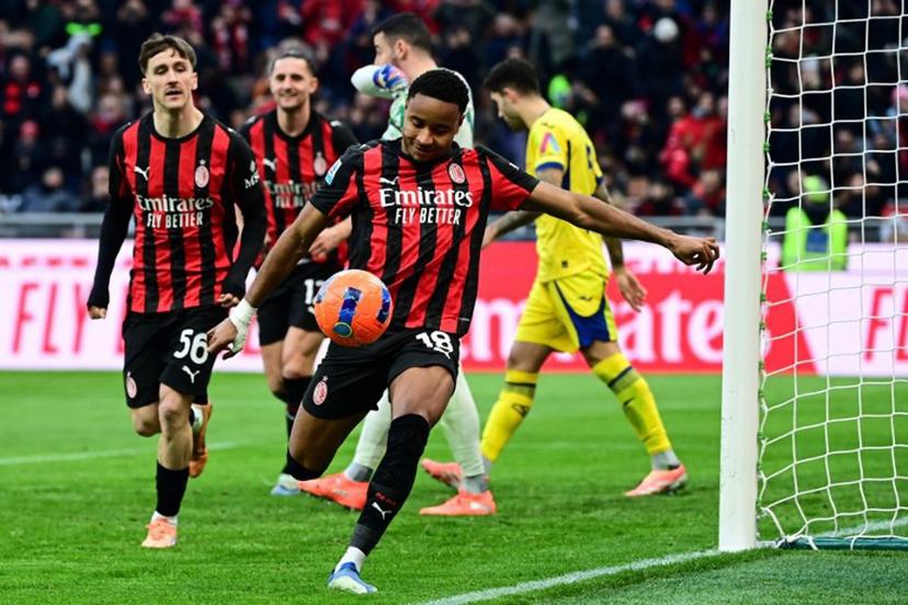 AC Milan's French forward #18 Christopher Nkunku (C) celebrates after scoring his team second goal during the Italian Serie A football match between AC Milan and Hellas Verona at the San Siro stadium in Milan, northern Italy, on December 28, 2025.  Piero CRUCIATTI / AFP