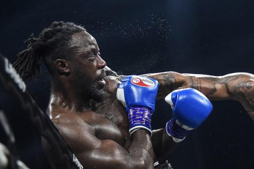 France's Tony Yoka (R) throws a jab at Belgium's Joel Tambwe Djeko during their EBU European Union heavyweight title boxing match at the H Arena in Nantes, western France, on March 5, 2021.   JEAN-FRANCOIS MONIER / AFP
