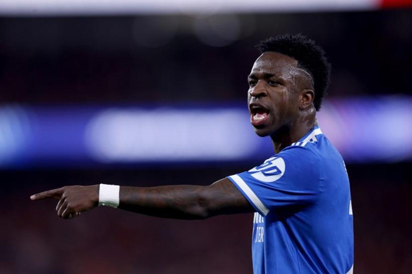 Real Madrid's Brazilian forward #07 Vinicius Junior gestures during the UEFA Champions League knockout round play-off first leg football match between SL Benfica and Real Madrid CF at Estadio da Luz in Lisbon on February 17, 2026.  FILIPE AMORIM / AFP