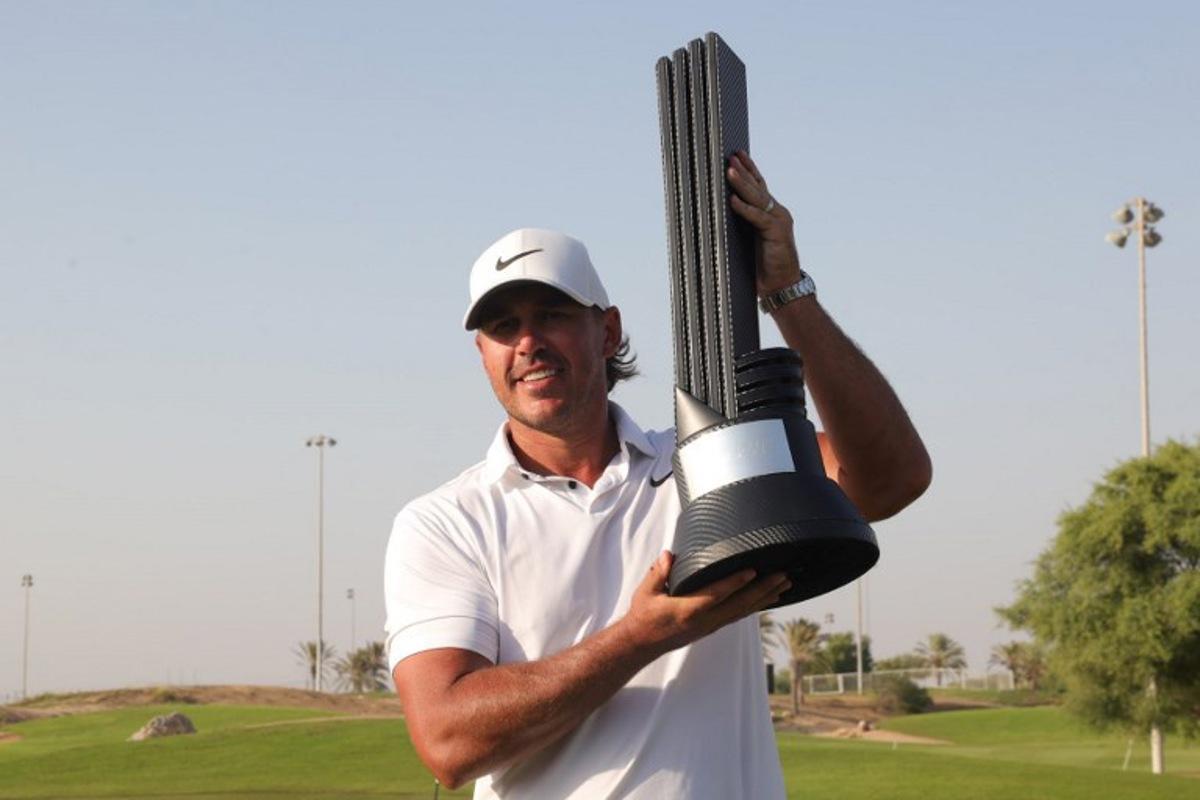 Brooks Koepka of the US celebrates his trophy after winning the 2023 LIV Golf Jeddah champion at Royal Greens Golf in Jeddah on October 15, 2023.  Fayez Nureldine / AFP