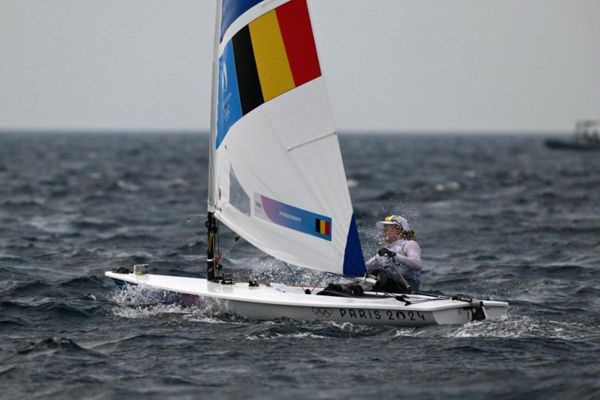 Belgium's Emma Plasschaert competes in the medal race of the women's ILCA 6 single-handed dinghy event during the Paris 2024 Olympic Games sailing competition at the Roucas-Blanc Marina in Marseille on August 7, 2024.   Christophe SIMON / AFP