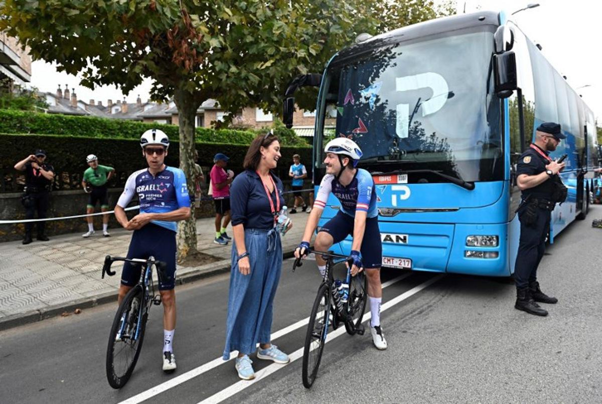 Team Israel Premier-Tech's Canadian rider Pier-Andre Cote (L) and Team Israel Premier-Tech Czech rider Jan Hirt prepare before the 12th stage of the Vuelta a Espana, a 144,9 km race between Laredo and Corrales de Buelna, on September 4, 2025.   ANDER GILLENEA / AFP