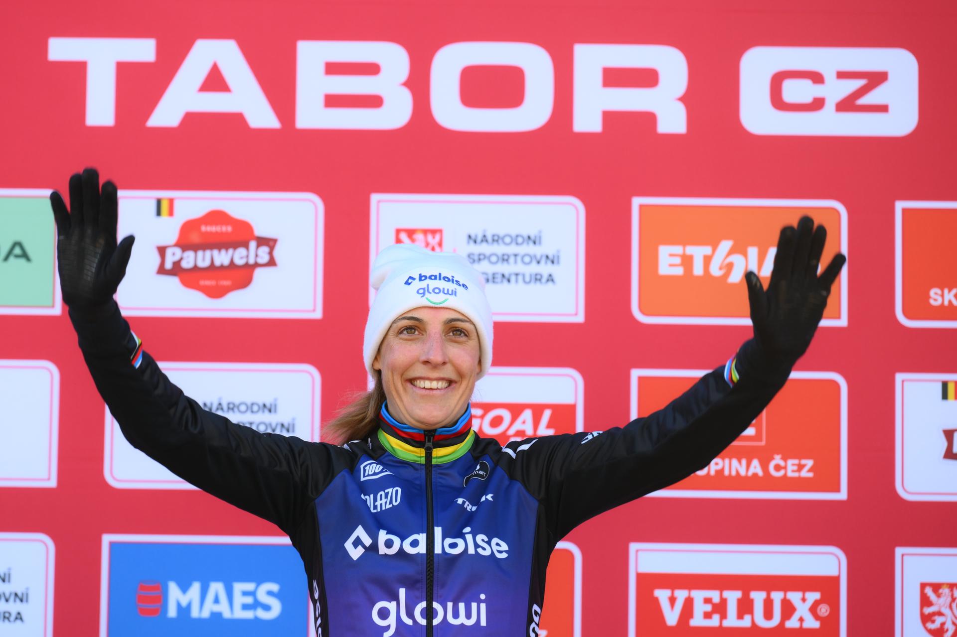 Dutch Lucinda Brand celebrates on the podium after winning the women elite race at the World Cup cyclocross cycling event in Tabor, Czech Republic, stage 1 (out of 12) of the UCI World Cup cyclocross competition, Sunday 23 November 2025. BELGA PHOTO DAVID PINTENS