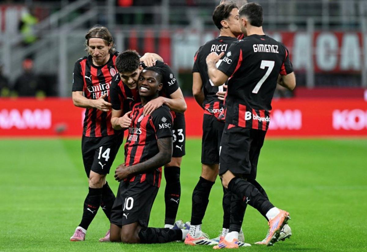 AC Milan's Portuguese forward #10 Rafael Leao (3rd L) celebrates with his teammates after scoring his team's opening goal during the Italian Serie A football match between AC Milan and Pisa SC at San Siro stadium in Milan, northern Italy, on October 24, 2025.  Stefano RELLANDINI / AFP