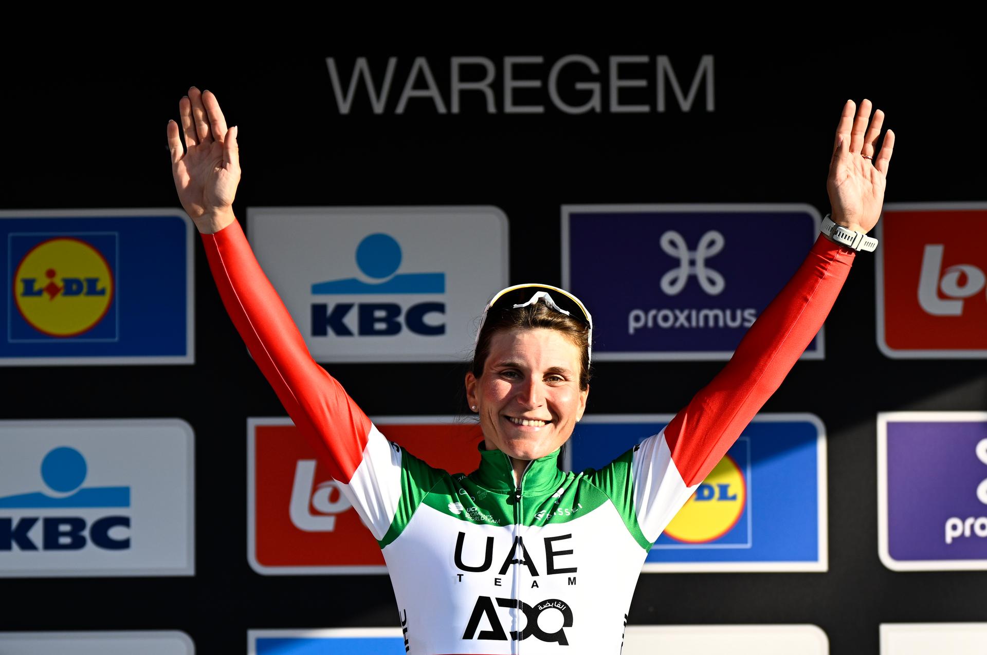 Italian Elisa Longo Borghini of UAE Team ADQ celebrates on the podium after winning the women elite race of the 'Dwars Door Vlaanderen' cycling event, 128,5km from and to Waregem, Wednesday 02 April 2025. BELGA PHOTO JASPER JACOBS