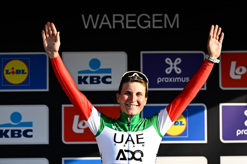 Italian Elisa Longo Borghini of UAE Team ADQ celebrates on the podium after winning the women elite race of the 'Dwars Door Vlaanderen' cycling event, 128,5km from and to Waregem, Wednesday 02 April 2025. BELGA PHOTO JASPER JACOBS