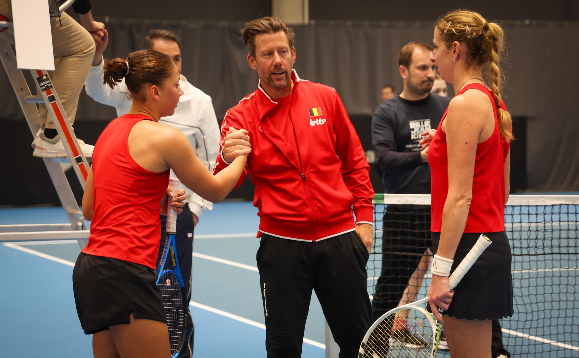 Belgian Sofia Costoulas, Belgian team captain Wim Fissette, Belgian Magali Kempen and celebrate after winning a double tennis match between Belgians Belgian Costoulas/Kempen and Greeks Christofi/Pavlou, in the qualifiers of the Billie Jean King Cup tennis, in Vilnius, Lithuania on Tuesday 08 April 2025. PHOTO VIRGINIE LEFOUR
