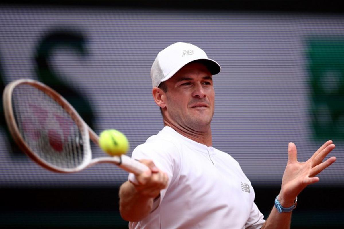 US Tommy Paul plays a forehand return to Australia's Alexei Popyrin during their men's singles match on day 8 of the French Open tennis tournament on Court Suzanne-Lenglen at the Roland-Garros Complex in Paris on June 1, 2025.  Anne-Christine POUJOULAT / AFP