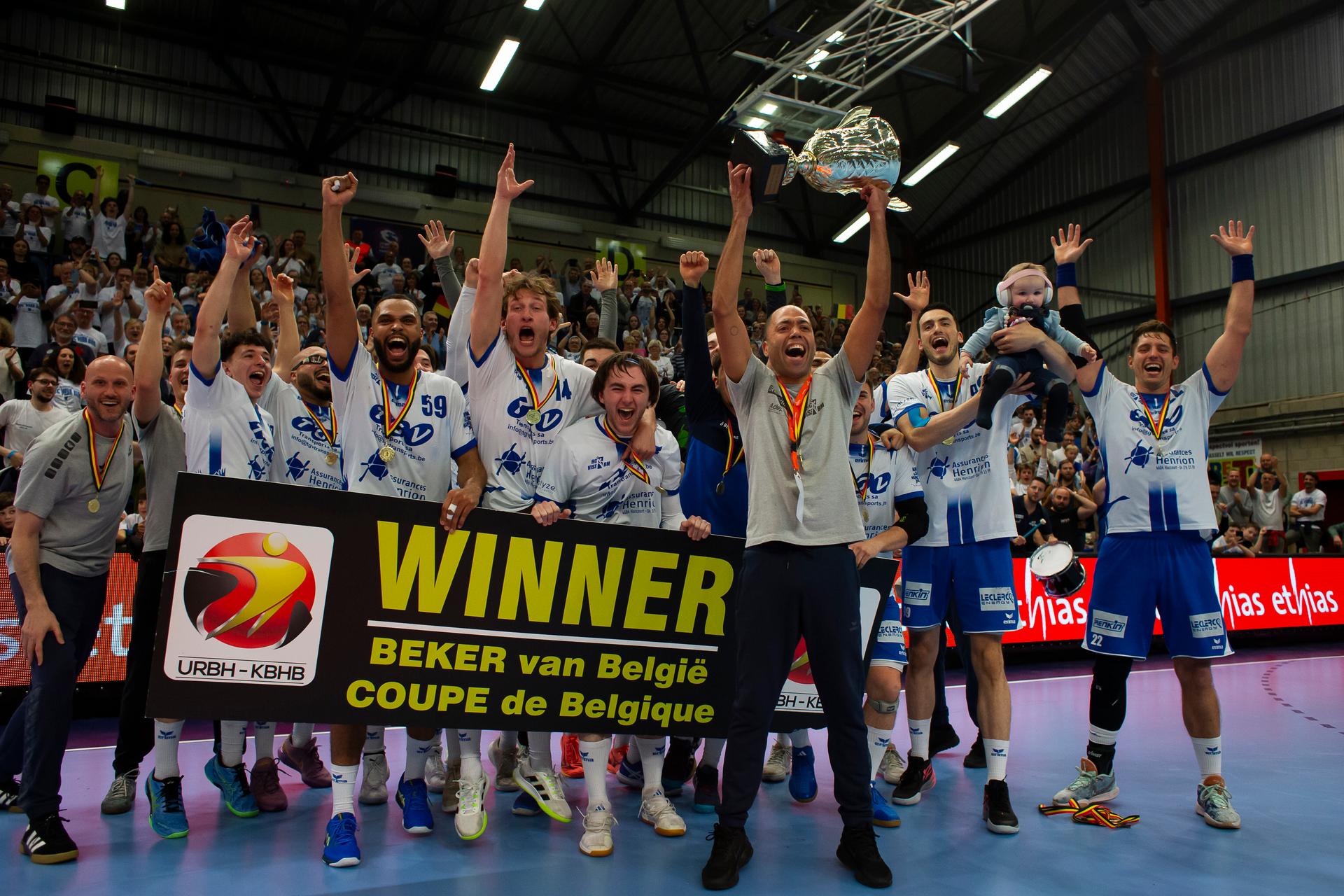 HC Vise BM players and staff celebrate after winning a game between KTSV Eupen and HC Vise BM, Saturday 30 March 2024, in Hasselt, the men's final of the Belgian handball cup. BELGA PHOTO KRISTOF VAN ACCOM