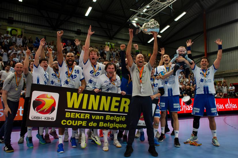 HC Vise BM players and staff celebrate after winning a game between KTSV Eupen and HC Vise BM, Saturday 30 March 2024, in Hasselt, the men's final of the Belgian handball cup. BELGA PHOTO KRISTOF VAN ACCOM